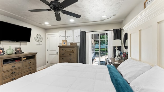 bedroom with access to outside and ceiling fan