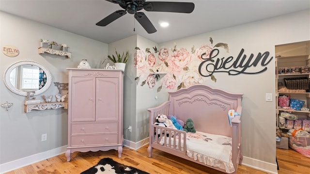 bedroom featuring light hardwood / wood-style floors and ceiling fan