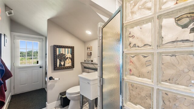 bathroom featuring vaulted ceiling, vanity, and toilet