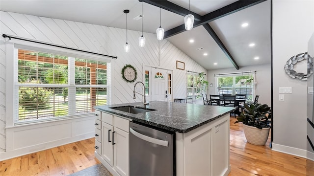 kitchen with vaulted ceiling with beams, sink, dishwasher, and light wood-type flooring