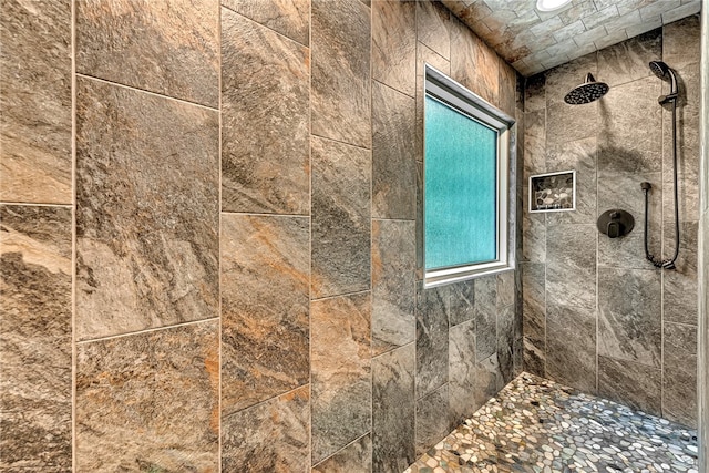 bathroom featuring a tile shower