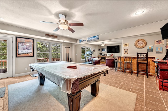 playroom featuring light tile patterned floors, pool table, a wealth of natural light, and ceiling fan