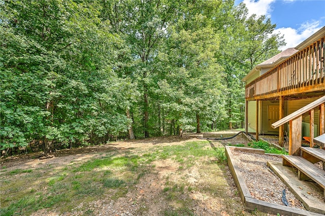 view of yard with a wooden deck