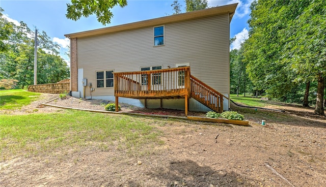 back of house featuring a deck