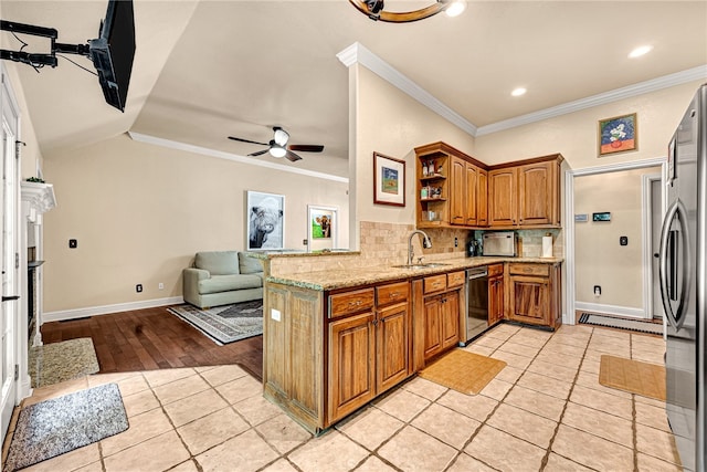 kitchen with crown molding, light hardwood / wood-style flooring, decorative backsplash, and ceiling fan