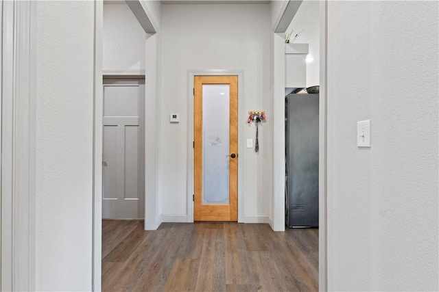 corridor with light wood-type flooring