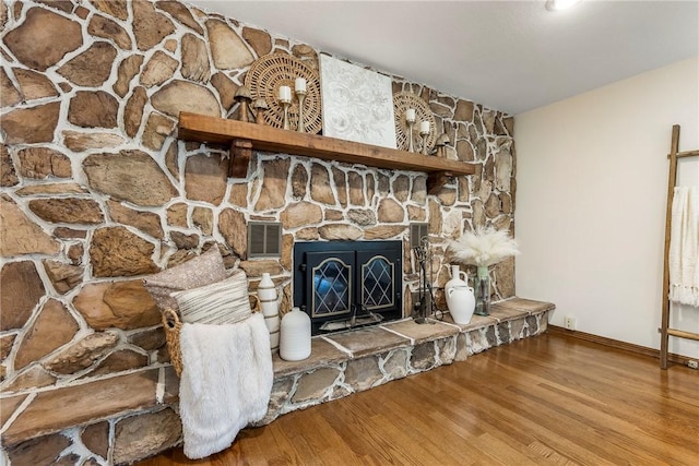 room details featuring a fireplace and hardwood / wood-style floors