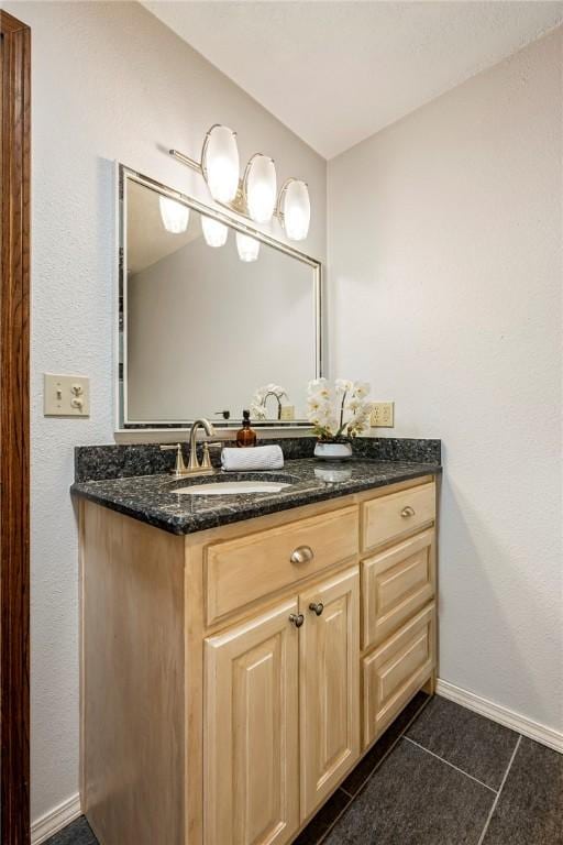 bathroom with tile patterned flooring and vanity