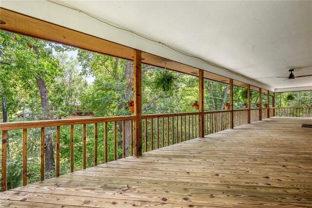 wooden terrace featuring ceiling fan