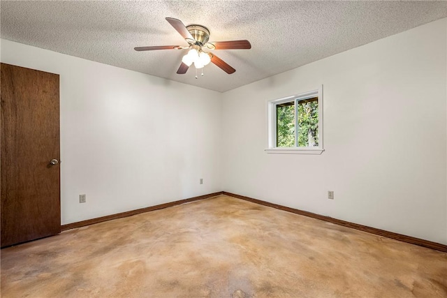 carpeted empty room featuring ceiling fan and a textured ceiling