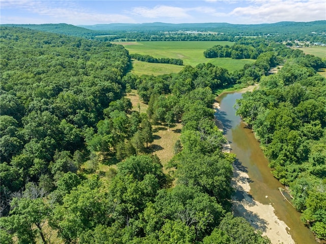 drone / aerial view with a water and mountain view