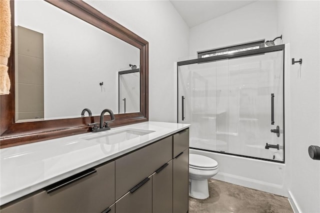 full bathroom with concrete flooring, bath / shower combo with glass door, vanity, and toilet