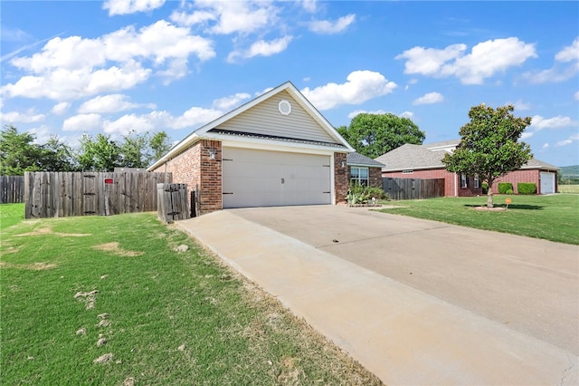 view of front of property featuring a garage and a front yard