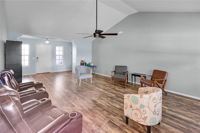 living room featuring lofted ceiling, hardwood / wood-style floors, and ceiling fan