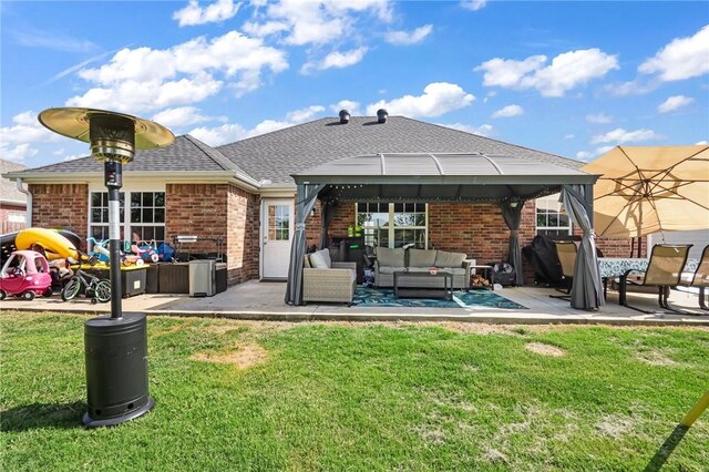 back of property featuring an outdoor living space, a yard, and a patio