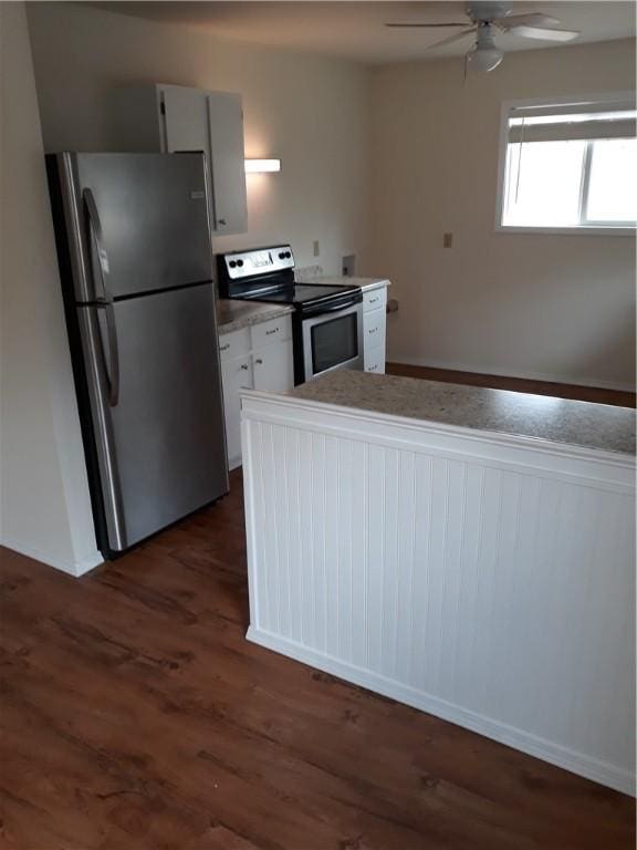 kitchen featuring ceiling fan, white cabinetry, dark wood-type flooring, and appliances with stainless steel finishes