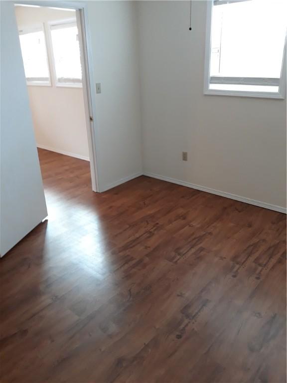 empty room featuring dark hardwood / wood-style floors