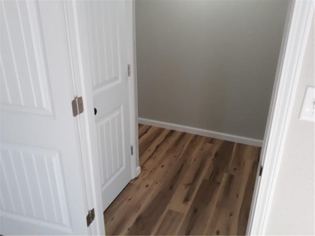 hall with dark hardwood / wood-style floors
