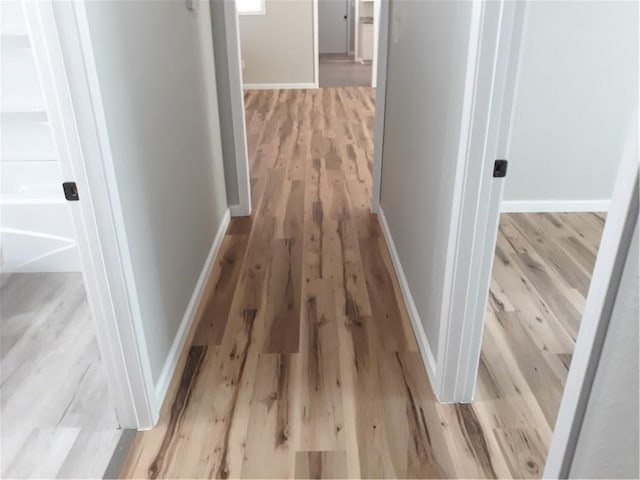 corridor featuring light wood-type flooring