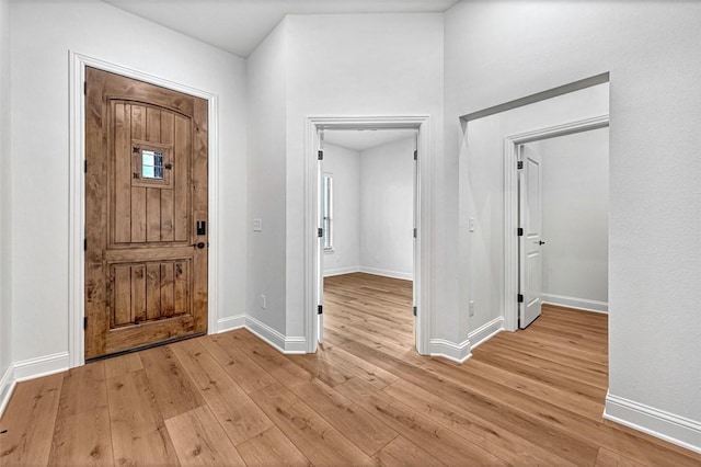 foyer entrance with light hardwood / wood-style floors