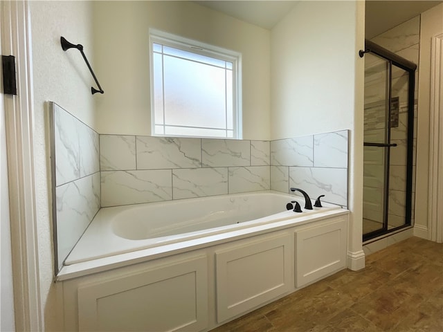 bathroom featuring tile patterned flooring and plus walk in shower