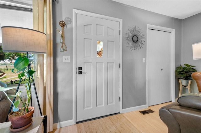 foyer with light wood-type flooring