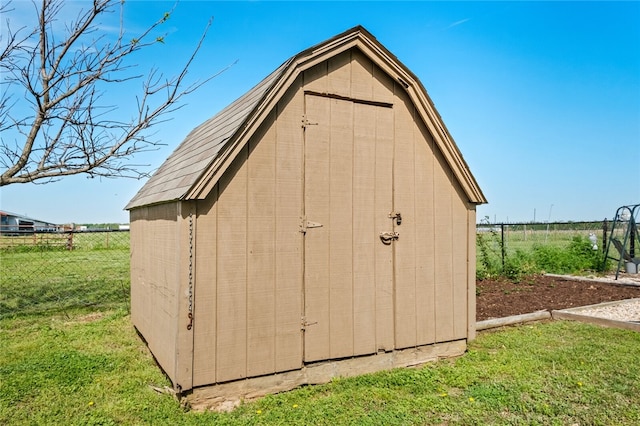 view of outbuilding with a lawn