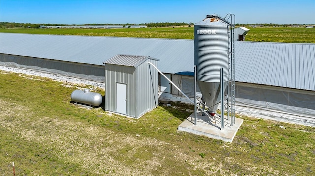 view of outdoor structure with a rural view