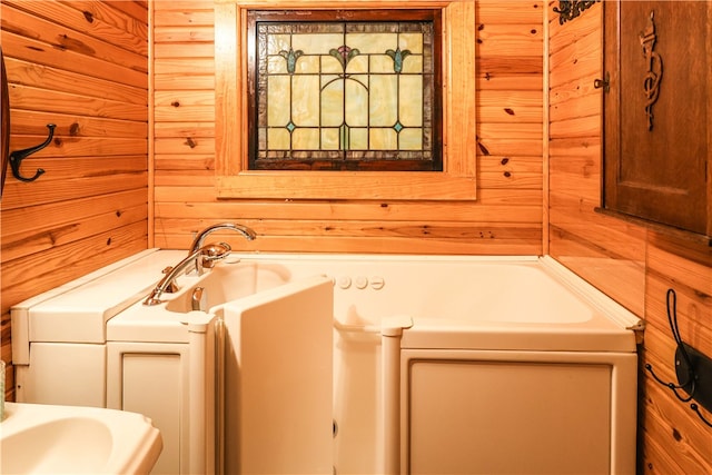 bathroom featuring wood walls