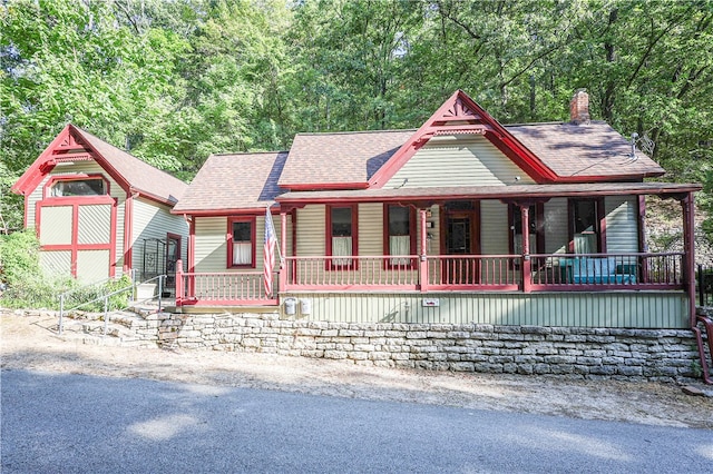 victorian house featuring a porch