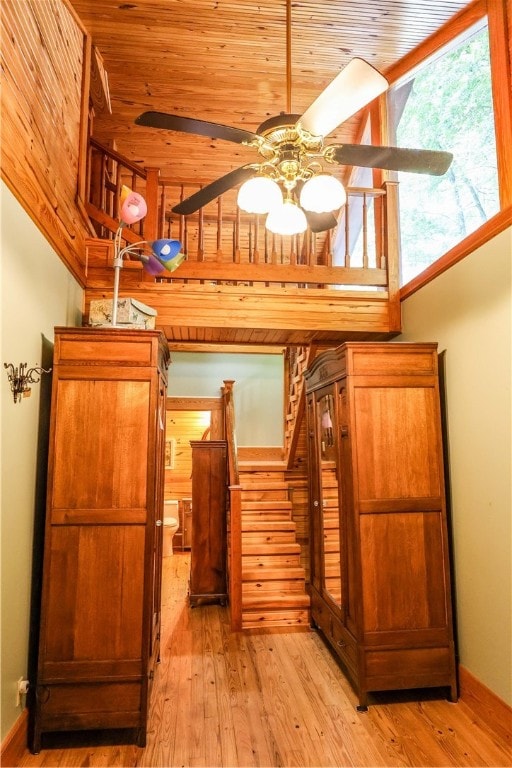 interior space featuring ceiling fan, hardwood / wood-style flooring, wood ceiling, and vaulted ceiling