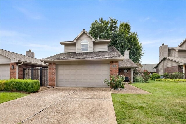 front of property with a garage and a front lawn