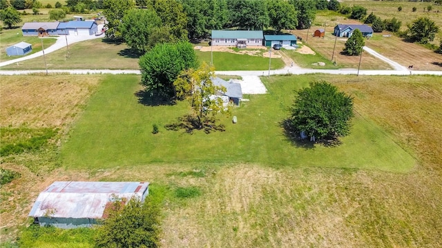 birds eye view of property featuring a rural view