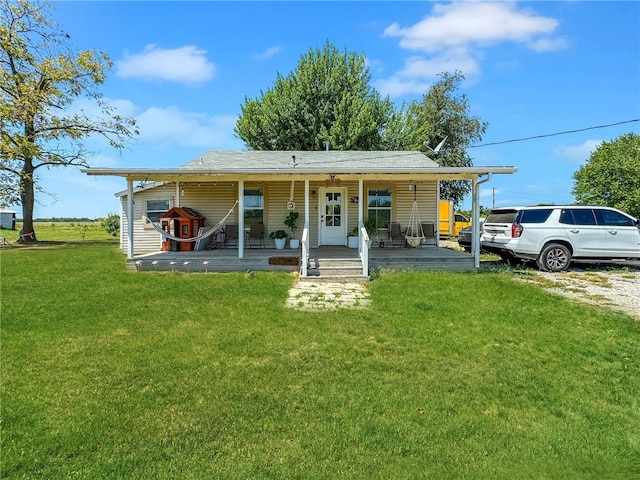 view of front facade with a porch and a front lawn