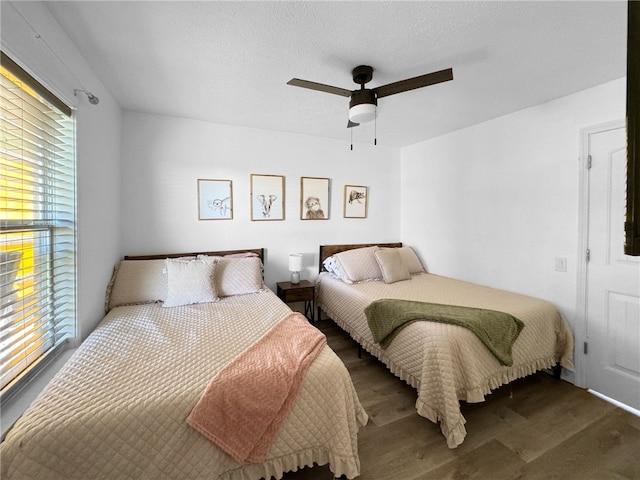 bedroom featuring ceiling fan and hardwood / wood-style flooring