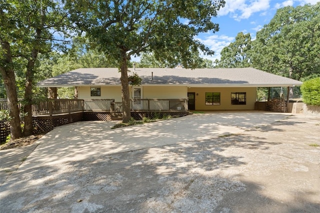 ranch-style home with concrete driveway