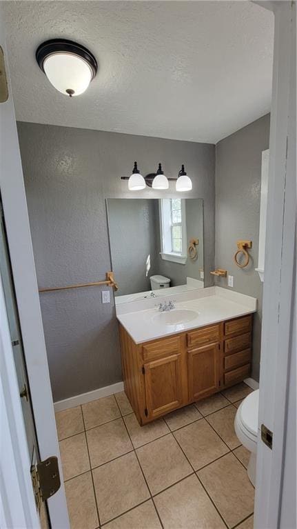 3810 Rainbow Farm Rd, Bentonville, AR 72713 - bathroom with tile patterned flooring, vanity, a textured ceiling, and toilet
