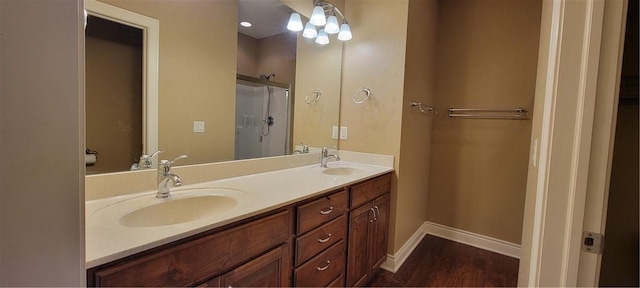 3810 Rainbow Farm Rd, Bentonville, AR 72713 - bathroom with vanity, wood-type flooring, and an enclosed shower