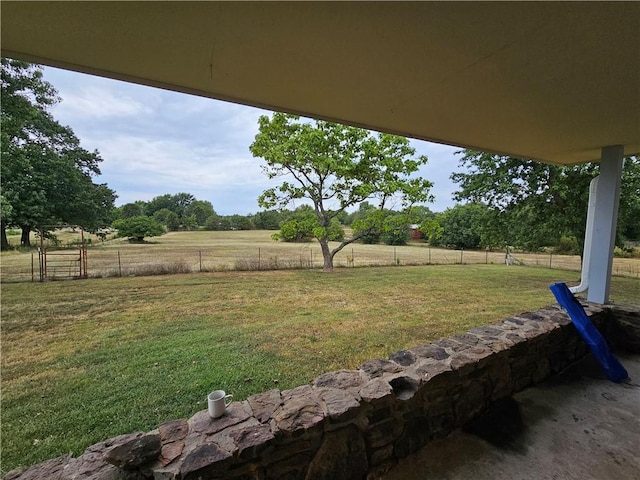 view of yard with a rural view