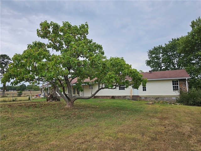 exterior space with a yard