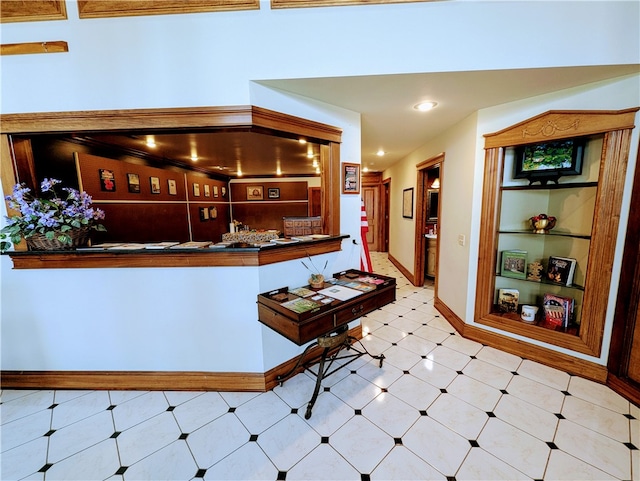 kitchen featuring tile patterned floors and built in features