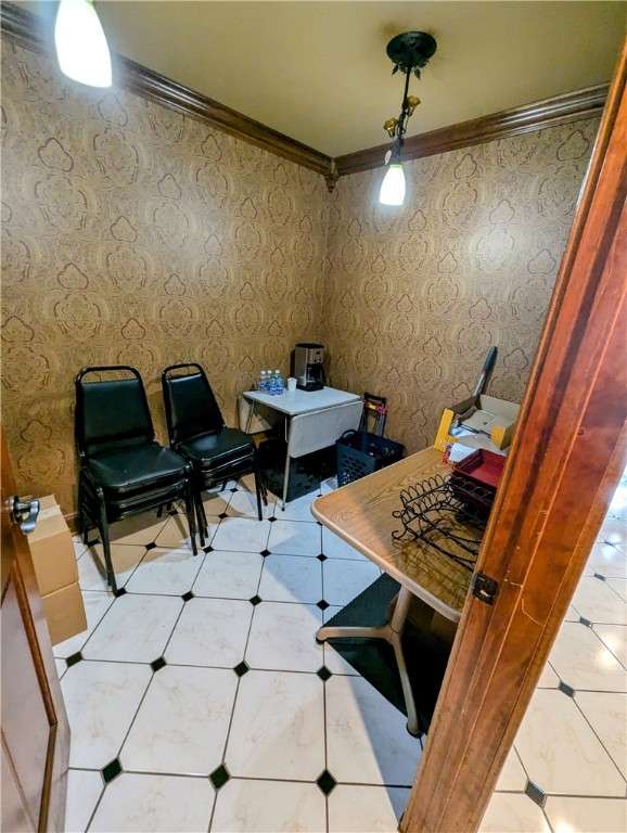 home office featuring ornamental molding and light tile patterned floors