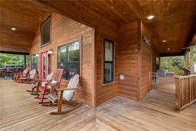 wooden terrace with a porch