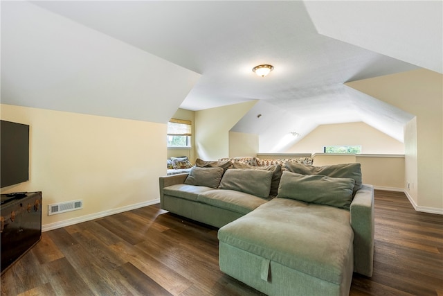 living room with dark hardwood / wood-style floors and vaulted ceiling