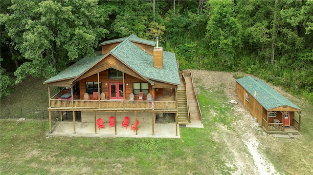 exterior space featuring an outbuilding and a patio area