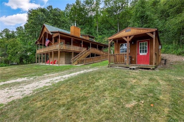 exterior space with a deck and a yard