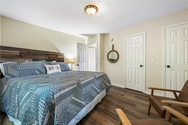 bedroom featuring dark wood-type flooring