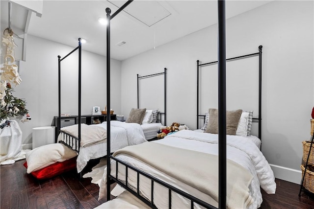 bedroom with wood-type flooring