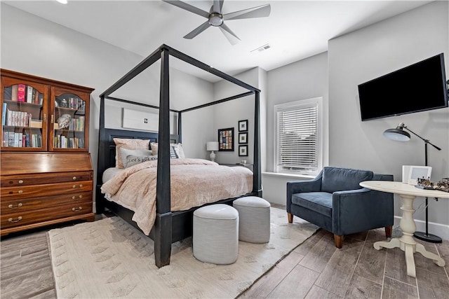 bedroom featuring ceiling fan and wood-type flooring