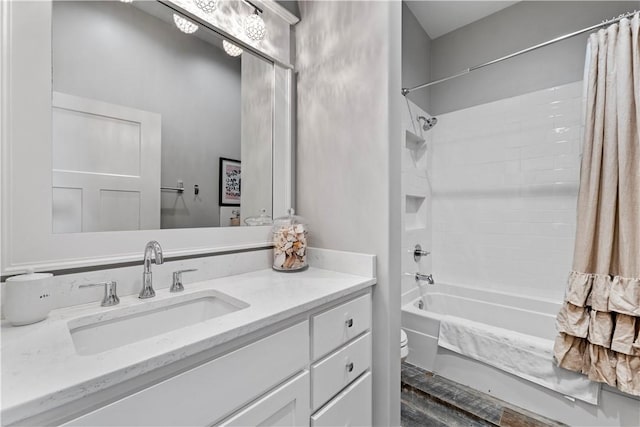 full bathroom featuring vanity, shower / tub combo with curtain, and toilet